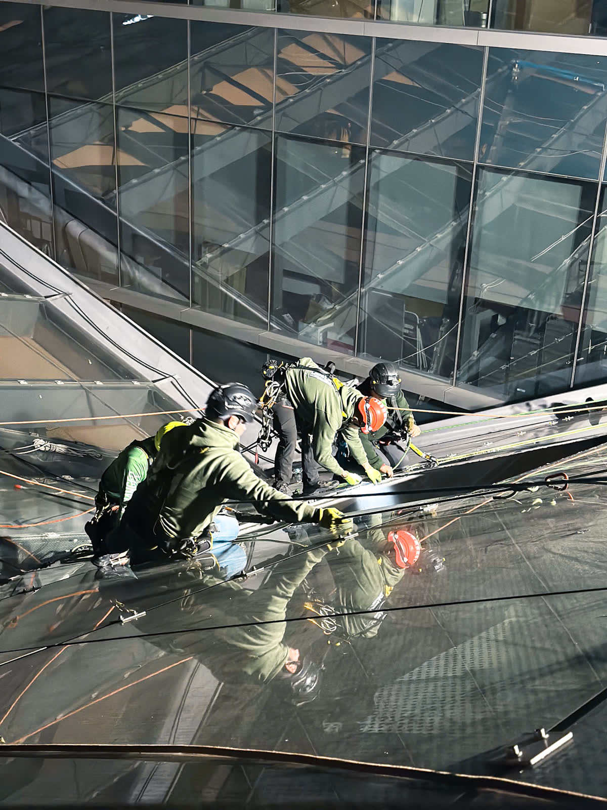 SKYHANGER 2 team on glass facade daytime